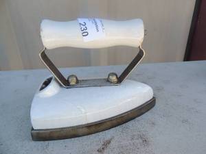 lot 230 image: Metal iron with handle marked Quality Iron quality appliances co.