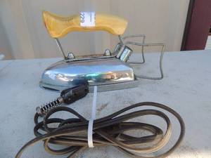 lot 229 image: Metal iron with wooden handle marked ABC no. 721 450 watts