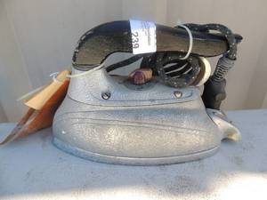 lot 239 image: Metal iron with handle and outlet cord Steam -o-matic model # B-300 Waverly tool co.
