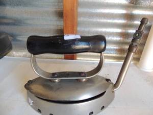 lot 240 image: Cast iron with handle marked Duo point central flat iron NFG. CO.