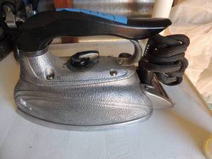 lot 242 image: Metal iron with handle and outlet cord steam o matic model no. B300 1000 watts Waverly tool co.