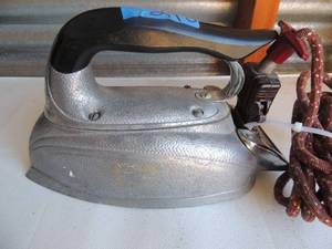 lot 248 image: Metal iron with handle and outlet cord marked steam-o-matic model c-100 535 watts
