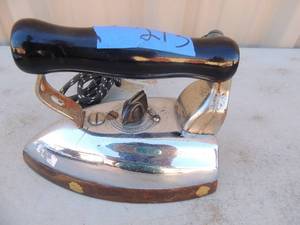 lot 273 image: Metal Iron with handle and power cord  Marked W.M. Cissell mfg. Co. Louisville KY 800 watts