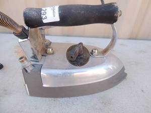 lot 293 image: metal iron with handle and outlet cord Sussman steam systems model no. M5-83792