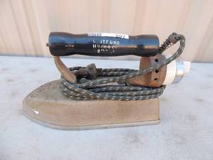 lot 297 image: Cast iron with handle and outlet cord Gross star electric iron mfg. Benrstockco. USA no.15014 20 lbs. 850 watts