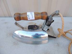 lot 317 image: Metal iron with handle and power cord Coleman master automatic 1000 wats
