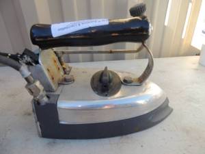 lot 333 image: Metal iron with handle and power cord Sussman steam systems