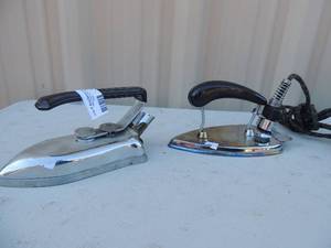 lot 376 image: Lot of two- Metal iron with handle and cord Greyhound Middleton & mead Co and one marked Travel made crop 375 watts