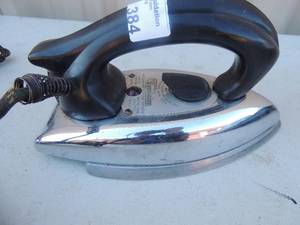lot 384 image: Metal iron with handle and cord  Dominion electric MFG 1000 watts