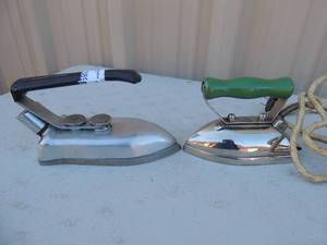 lot 389 image: Lot of 2 Metal irons with handles and cords Chicago on one and the other Greyhand Middleton and Mead 750 watts