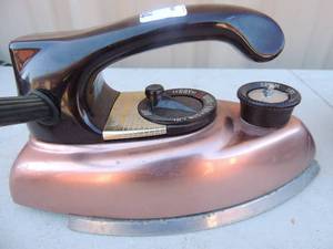 lot 394 image: Metal iron with handle and cord  Westinghouse adjust-o-matic  steam iron