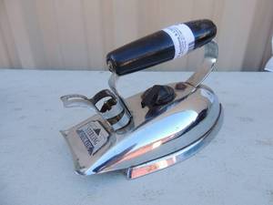 lot 399 image: Metal iron with handle and cord  Sterling Automatic Chicago Electric MFG. Co.