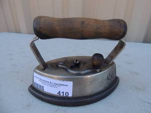 lot 410 image: Cast iron with removable handle marked Dover sad iron no. 2