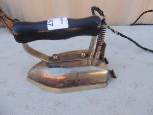lot 457 image: Metal Iron with handle and cord  Illegible writing