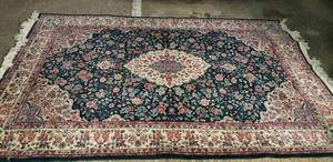 lot 24 image: Green Area Rug 59x 89