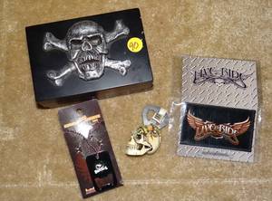 lot 90 image: BOUNTIFUL PIRATE STORAGE BOX WITH BIKER SEW ON PATCH, HANGING NECK CHAIN BOTTLE OPENER, AND COOL SKULL MAGNET BOTTLE OPENER