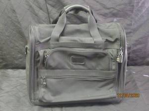 lot 133 image: TUMI ROLLING TRAVEL BAG PROPERLY WORN FACE COVERING REQUIRED