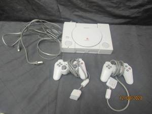 lot 148 image: SONY PLAYSTATION WITH 2 CONTROLLERS
