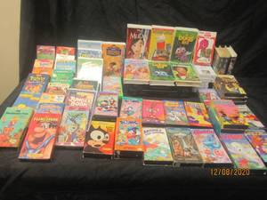 lot 152 image: 50 PLUS KIDS VHS TAPES AND SHARP VC-A410 VCR