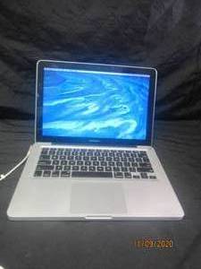 lot 186 image: WORKING MAC BOOK PRO PROPERLY WORN FACE COVERING REQUIRED