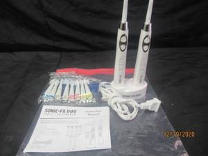 lot 215 image: SONIC-FX DUO ELECTRIC TOOTHBRUSHES WITH A PACK OF 8 NEW IN SEALED PACKAGE BRUSHES