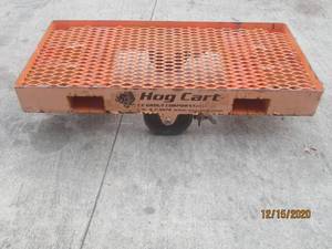 lot 298 image: HEAVY DUTY HOG CART WITH STEER TIRES. THIS CART WILL HOLD THE WEIGHT OF A VEHICAL MOTOR AND MORE