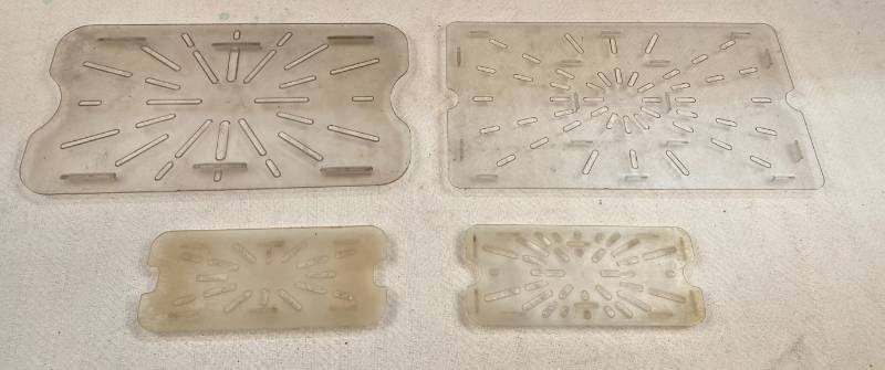 lot 112 image: 4 Plastic Trivets 2 Large 2 small