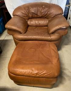 lot 102 image: Brown Leather Swivel Chair with ottoman