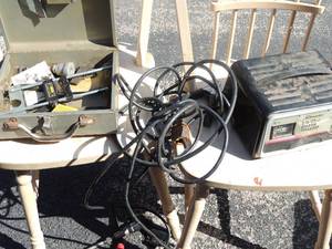 lot 43 image: Metal box containing Stanley starter router guide electric tool, shaper cutter, sparkplugs with starter charger Schumacher