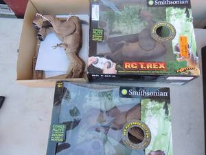 lot 7 image: 2 NIB RC-T-rex dinosaurs with remote and 1 with no remote SMITHSONIAN