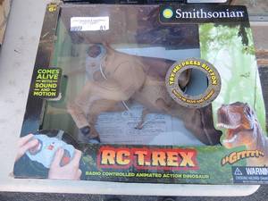lot 81 image: NIB RC-T-rex dinosaurs with remote and 1 with no remote SMITHSONIAN