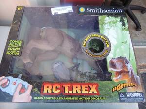 lot 82 image: NIB RC-T-rex dinosaurs with remote and 1 with no remote SMITHSONIAN
