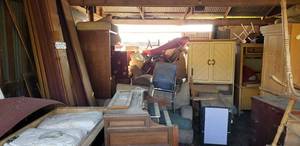 lot 156 image: Remaining Contents of building Not lotted large quantity of items including organ, Fridge, appliances, desk, cabinets more church pews, office chairs recliners and more possible treasures unknown.