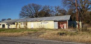 lot 157 image: Old store building30x110 entire building on pad, metal and wood trusses, doors, sides, metal shelving. also detached 12x15 shed Owner request that it be taken down by 15. January 2021. will work with you. Payment is due day of pickup.