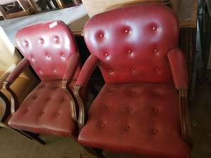 lot 69 image: Matched set of vintage Gilbert reception chairs with padded arm rests, wood legs and arms and rounded backs with brass tacking