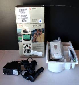 lot 28 image: VINTAGE SPRINT PCS FLIP PHONE - NEW WITH ALL ATTACHMENTS IN BOX