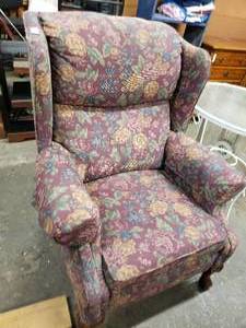 lot 44 image: Queen Anne Style Upholstered Wingback Recliner by Action Industries