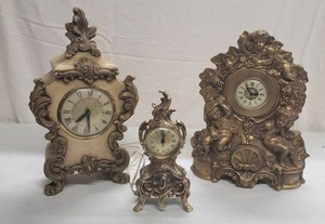 lot 53 image: Ornate Ceramic and Metal Plug-In Clocks