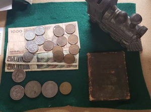 lot 63 image: Souvenir Pesos and Metal Train Piggy Bank, Plus Copy of Enoch Arden by Tennyson