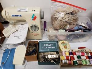 lot 176 image: Mighty Mender W100 Sewing Machine and  Attachments, Vintage Gloves, and variety of Sewing Thread