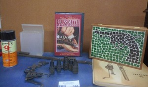 lot 151 image: Gun Parts Including Mosseberg 20ga. Chokes IC, MD,FL and 410 Chokes, Hammers and Sights Plus Gun Box, Gunsmith Video and Hoppes Spray