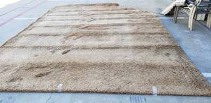 lot 157 image: Large Brown Shag Rug 12x16 with finished corner section as shown
