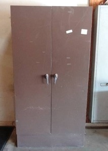 lot 10 image: Metal Cabinet w contents including vintage surge supressors, office phones and misc. office equipment. cabinet 36 x 72 x 19