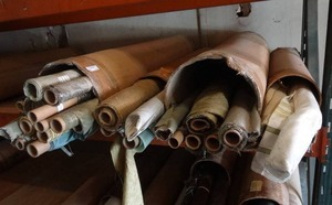 lot 12 image: Large selection of fabric rolls.  Generous quantity.  Patterns vary.