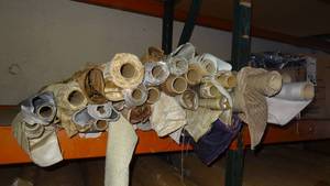 lot 17 image: Large selection of fabric rolls.  Generous quantity.  Patterns vary.