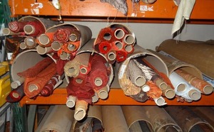 lot 21 image: Large selection of fabric rolls.  Generous quantity.  Patterns vary.