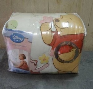 lot 60 image: Disney Winnie the Pooh 4-piece crib bedding set.  Never opened.