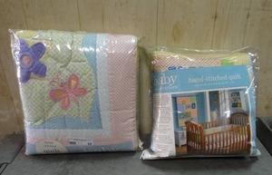 lot 69 image: Baby by Carters hand stitched quilts.  Quantity of 2.  Never opened.