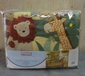 lot 73 image: Bedtime Originals Jungle themed 4-piece crib bedding set.  Never opened.