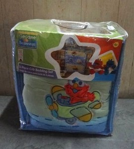 lot 94 image: Sesame Street Beginnings 3-piece crib bedding set.  Never opened.